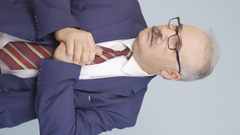 Vertical-video-of-Anxious-and-fearful-old-businessman.